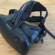 The finished consumer version of the HTC Vive. The headphone jack dangles from the back and works with any standard headphones.